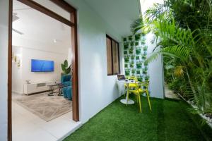 a room with a table and chairs and a dining room at 2 bedroom in watamu in Watamu