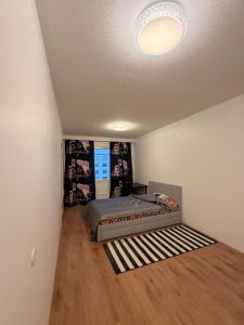 a bedroom with a bed and a ceiling at Helsinki Matinkylä Apartment in Espoo +23 photos