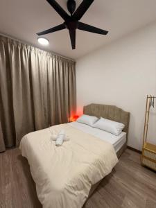 a bedroom with a bed with a stuffed animal on it at UKM GMI Mirai Residence Kajang 2 in Kajang