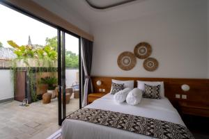 Giường trong phòng chung tại To Be La Villa Jimbaran +29 ảnh