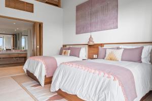 Ένα ή περισσότερα κρεβάτια σε δωμάτιο στο Beautiful PH apartment in Punta Mita, acces beach Club