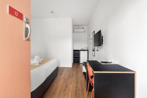 Televiisor ja/või meelelahutuskeskus majutusasutuses The Palms Motel- Formerly Flinders Motel