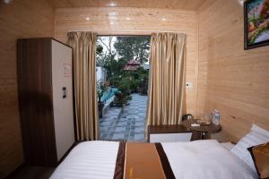 Ένα ή περισσότερα κρεβάτια σε δωμάτιο στο Tamcoc Athletic Bungalow & Villa