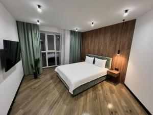 Ένα ή περισσότερα κρεβάτια σε δωμάτιο στο Сучасні апартаменти в районі автовокзалу ЖК Great House,поруч обласна лікарня,центр