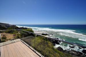 a view of the ocean from a balcony at Cliffhanger Estate in Keurboomstrand