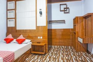 Ένα ή περισσότερα κρεβάτια σε δωμάτιο στο Hotel O Penginapan Dafandra Beach Near Pantai Tanjung Bira +19 φωτογραφίες