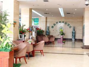 a lobby with chairs and tables in a building at GreenTree Inn Tianjin Wuqing Distric Bohai Market in Dadunqiu