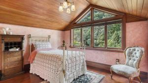 a bedroom with a bed and a window at Mt Eden Victorian Villa in Auckland