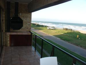 a balcony with a view of the beach at Blue Horizon Flat 8 in Jeffreys Bay