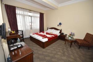 Llit o llits en una habitació de Pension Vasana Hotel