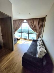 Ένα ή περισσότερα κρεβάτια σε δωμάτιο στο Make Memories Cozy 2BR Family Suite Summer Mall