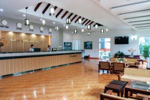 a hotel lobby with a bar in the middle of it at Sao Mai Phu My Resort in Phú Mỹ