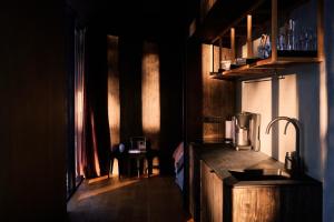 a kitchen with a sink and a counter top at Coastal Forest Cabin in Sweden in Söderhamn