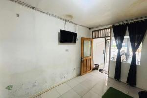 TV a/nebo společenská místnost v ubytování OYO 95057 Abe Homestay