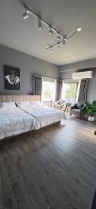 a bedroom with a large bed in a room at 陌野輕旅民宿 in Xiulin +54 photos