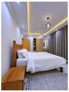 Postel nebo postele na pokoji v ubytování kisumu 3bedrooms