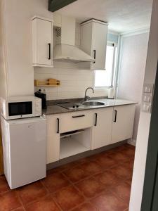 Kuchyň nebo kuchyňský kout v ubytování Estudio recién decorado en el mejor centro histórico