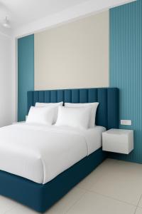 Ένα ή περισσότερα κρεβάτια σε δωμάτιο στο Hotel I