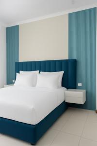 Ένα ή περισσότερα κρεβάτια σε δωμάτιο στο Hotel I