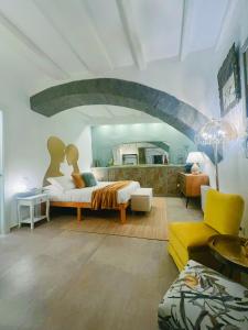 a living room with a bed and a couch at PapalePapale B&B in Viterbo