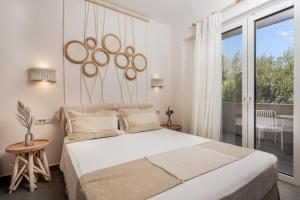 Ένα ή περισσότερα κρεβάτια σε δωμάτιο στο Spiros Family Apts