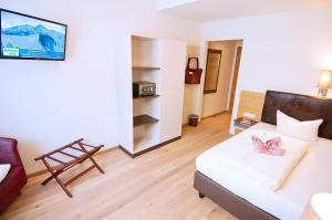 Letto o letti in una camera di Hotel Zauchensee Zentral