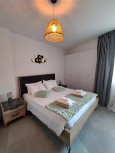 Giường trong phòng chung tại Lazuli City Center Ap 11 +42 ảnh