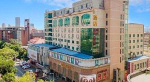 a tall building with a lot of windows on it at IU Hotel Tianjin Tianta Scenic Spot Wujiayao Metro Station in Tianjin