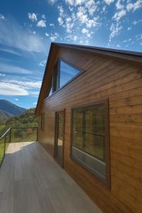 a house with a deck with a view at SkyGona in Ghebi