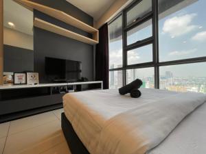 Ένα ή περισσότερα κρεβάτια σε δωμάτιο στο The Robertson Bukit Bintang by TALKS COLLECTION +29 φωτογραφίες