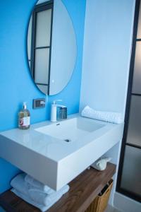 a bathroom with a white sink and a mirror at 午木wumu 民宿 in Hengchun +17 photos