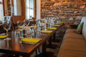 a long table in a restaurant with glasses on it at McGrory's Hotel in Culdaff