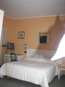 Postel nebo postele na pokoji v ubytování Albergo Sangrilà