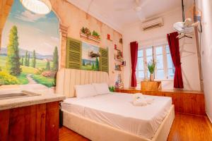 Postel nebo postele na pokoji v ubytování An Homestay Lakeview Apartment