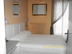 Postel nebo postele na pokoji v ubytování Albergo Sangrilà