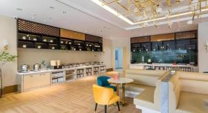 Posezení v ubytování Magnotel Business Yangzhou China Grand Canal Museum Wanda Plaza