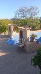 a bench sitting on a patio next to a pool at Finca Sencilla in Mijas