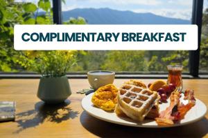 a plate of breakfast food on a table at Laurel Valley Mountain Retreat in Townsend