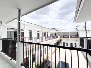 a view from the balcony of a white building at HAJIMENA INN Syariah By Hans Management in Hajimana