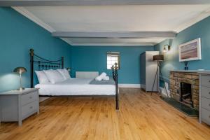 Ένα ή περισσότερα κρεβάτια σε δωμάτιο στο Golden Sands Cottage - Elie