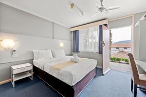 Voodi või voodid majutusasutuse The Palms Motel- Formerly Flinders Motel toas