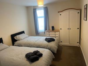 Postel nebo postele na pokoji v ubytování Morecambe apartments