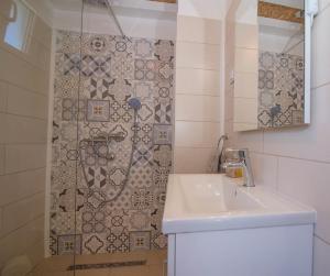 a bathroom with a sink and a shower at Andrej studio A2 in Veli Lošinj +36 photos