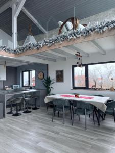 a dining room with a table and chairs at SweetNest in Gurahonţ