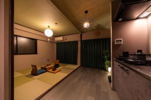 an empty room with a living room with a table at おやど紀伊国屋えびす町 in Nagasaki