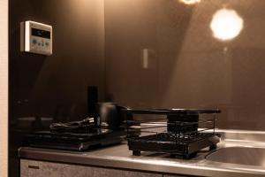 Kuchyň nebo kuchyňský kout v ubytování おやど紀伊国屋えびす町 + 68 fotografií