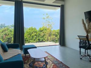 Et tv og/eller underholdning på Kanchaya Residence Apartment