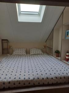 En eller flere senge i et værelse på Het rode Boothuis