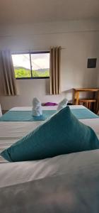 Ένα ή περισσότερα κρεβάτια σε δωμάτιο στο Lunazul Guesthouse