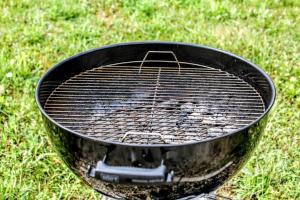 a grill sitting on top of a field of grass at Gîte Gué Léger - Nature & Spa - Jacuzzi, Sauna - Piscine chauffée toute l'année - 15 pers in Chanceaux-près-Loches +28 photos